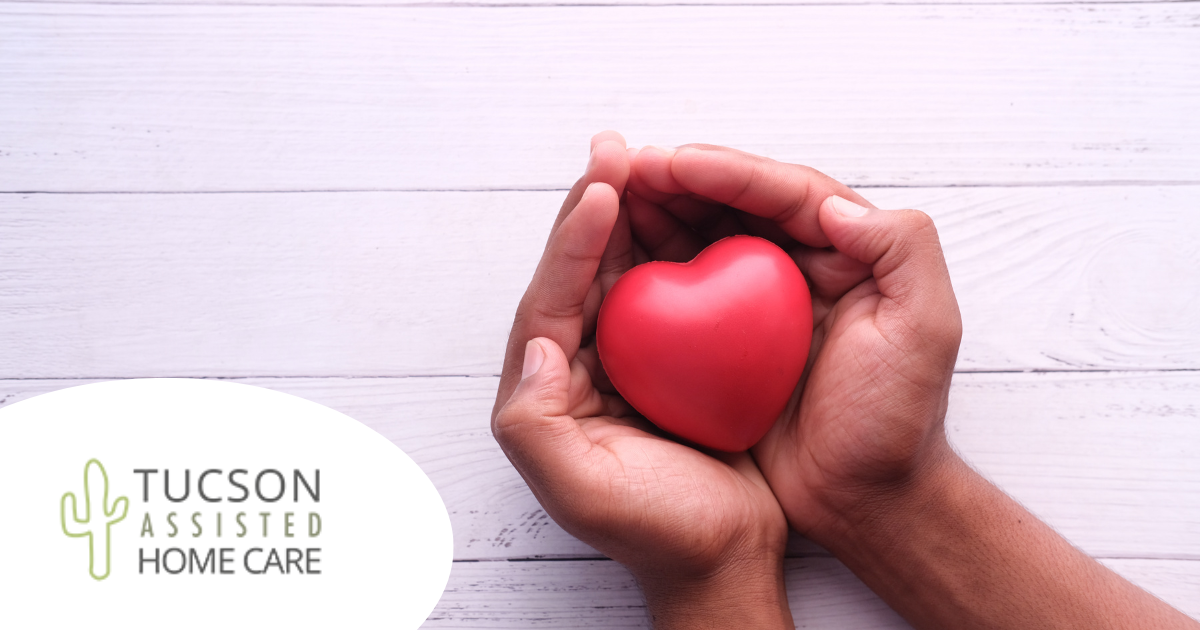 Hands holding a heart shape represent the care and support that those caring for seniors at home need.