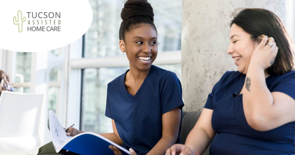 2 women study together to meet the requirements for being a professional caregiver.