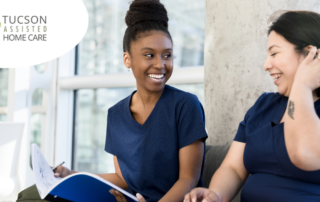2 women study together to meet the requirements for being a professional caregiver.