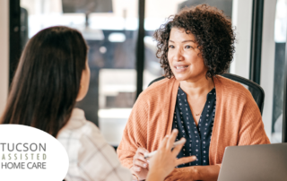 A woman interviews another woman for a caregiver job position.