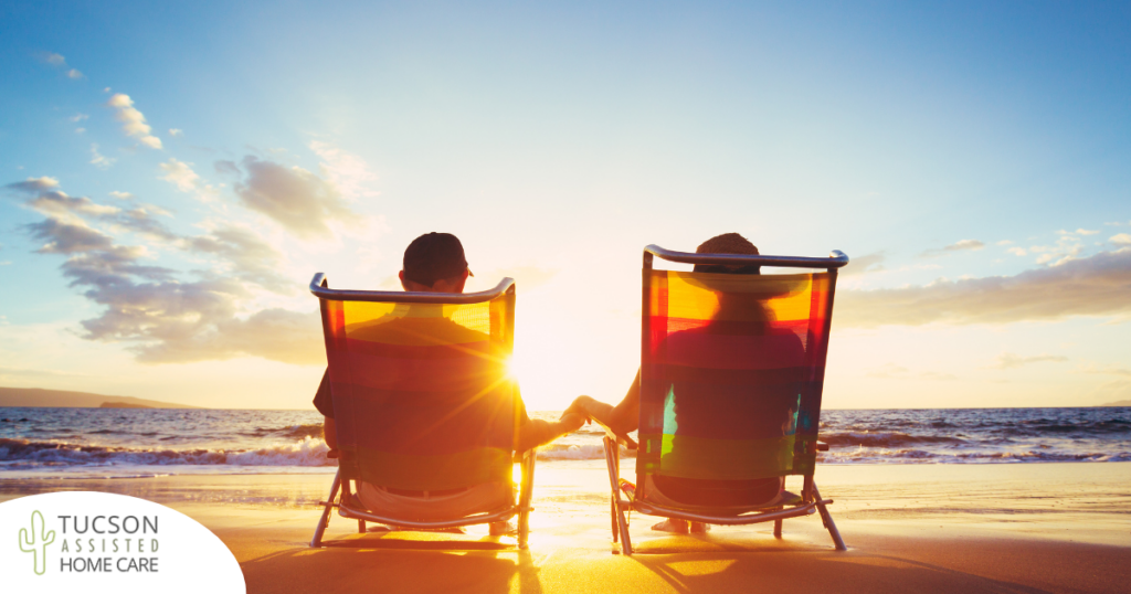 Caregiver travel hacks can help couples like this one on the beach enjoy their vacation.